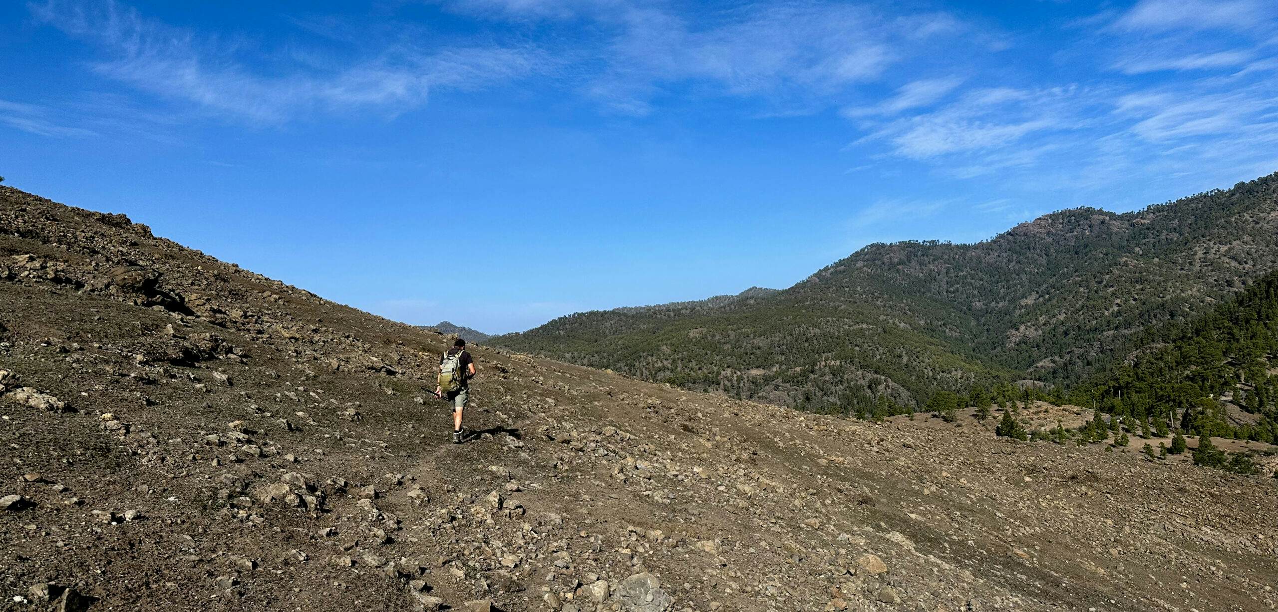 Hiker on the hiking trail below the Risco Grande