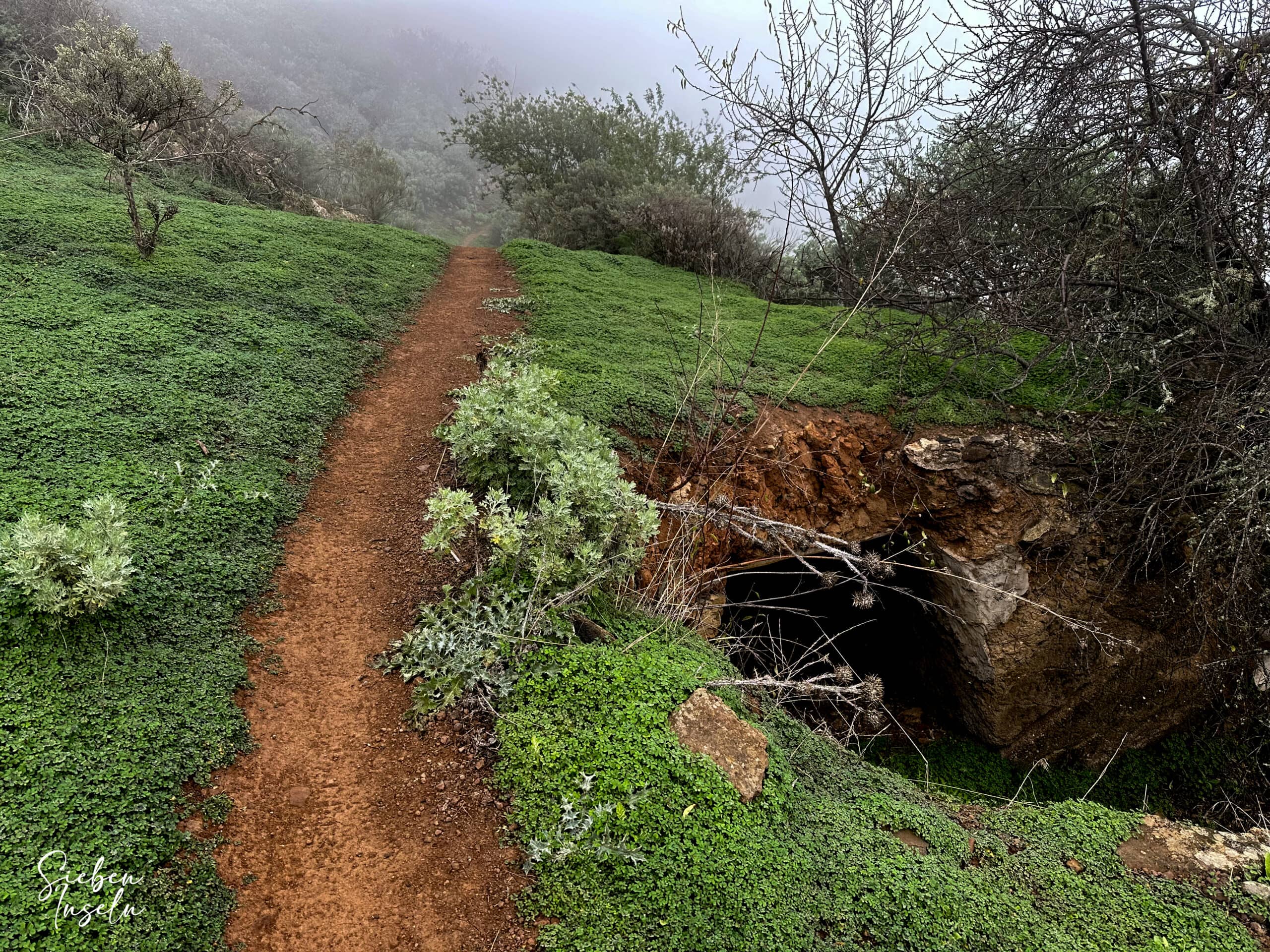 Hiking trail over the mountain ridge after the steep ascent below the Caldera de Los Marteles