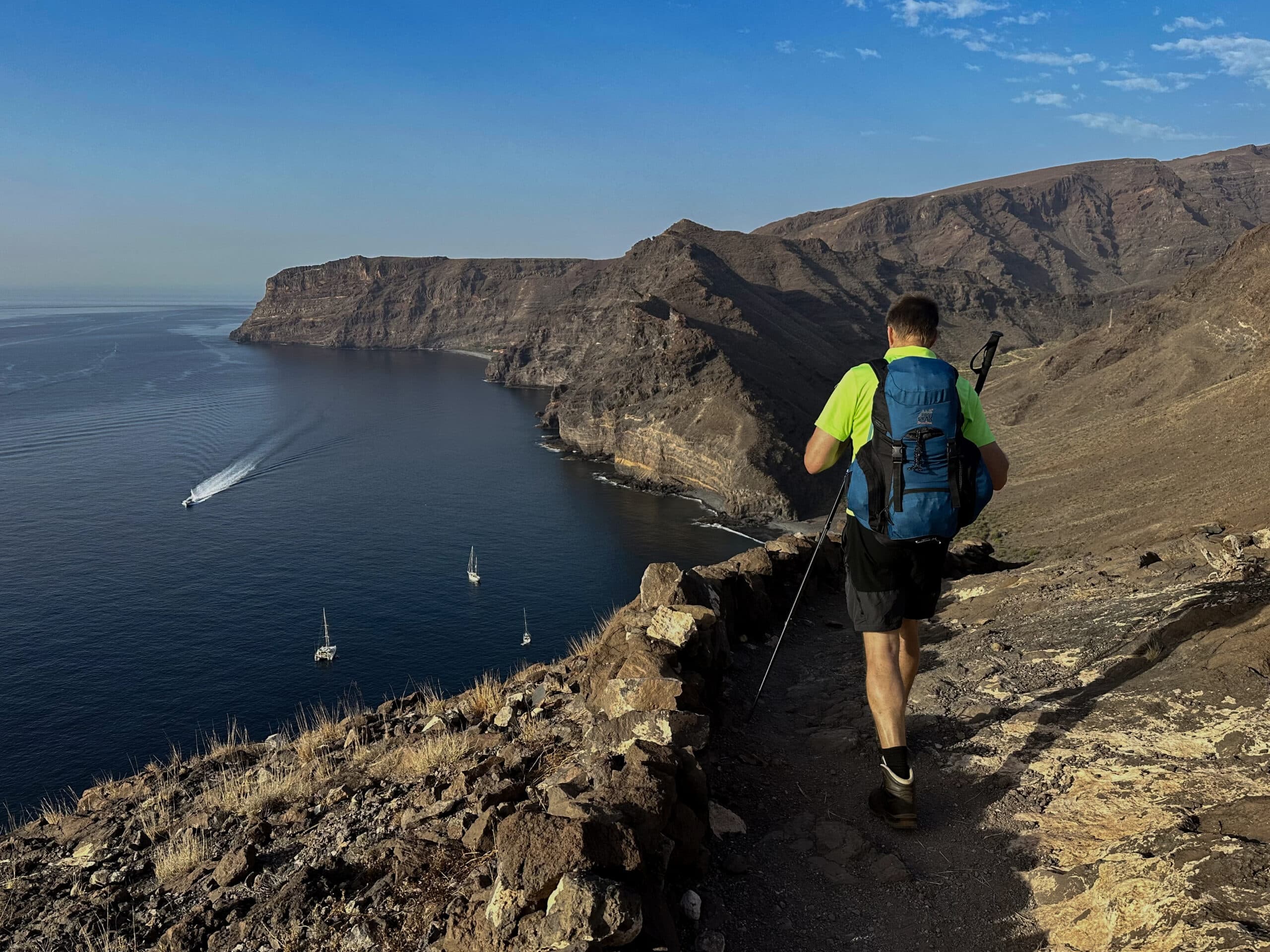 Hiker on the GR-132 hiking trail high above Playa de La Guancha