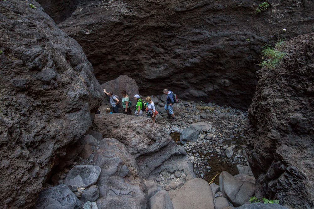 Masca gorge - hikers in a narrow part of the barranco