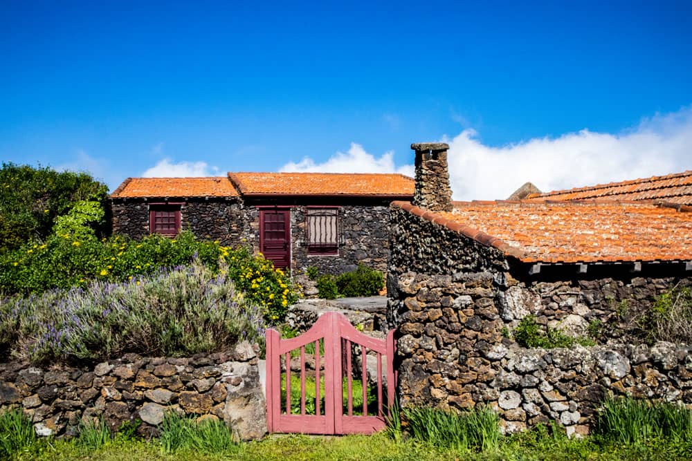 Stone houses and green vegetation along the way