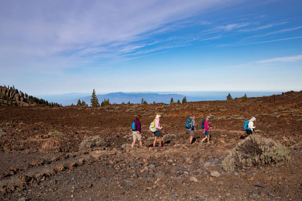 Hikers on footpaths - background La Gomera and El Hierro