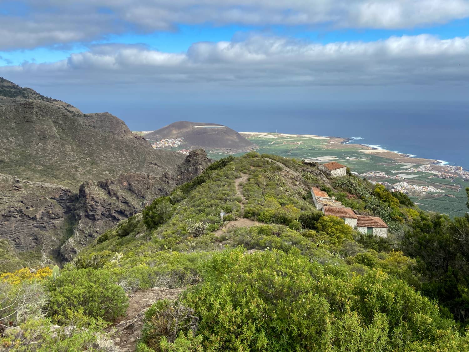 View over ruined houses to the north coast