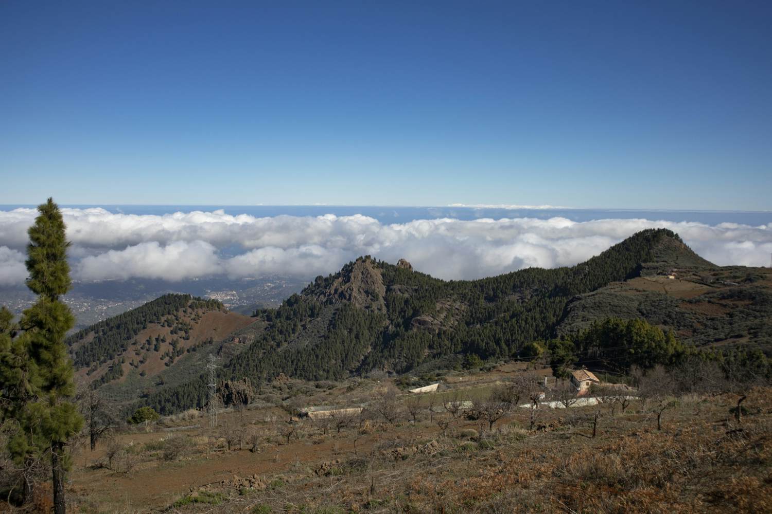 View over the mountain ranges and the clouds from the Becerra hiking trail