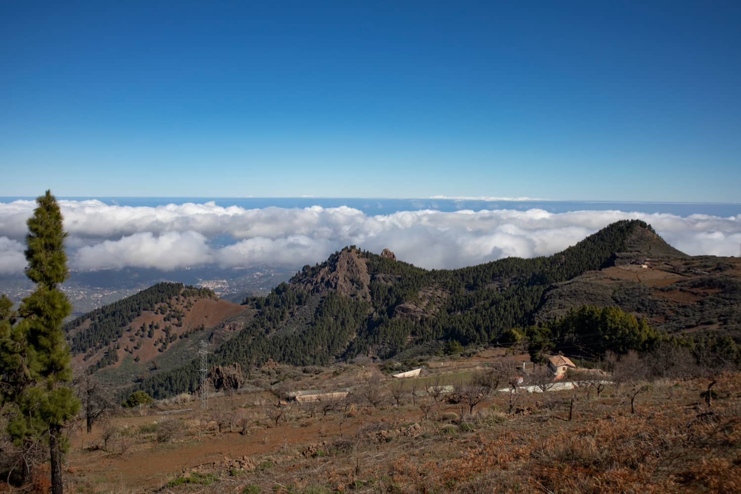 View over the mountain ranges and the clouds from the Becerra hiking trail