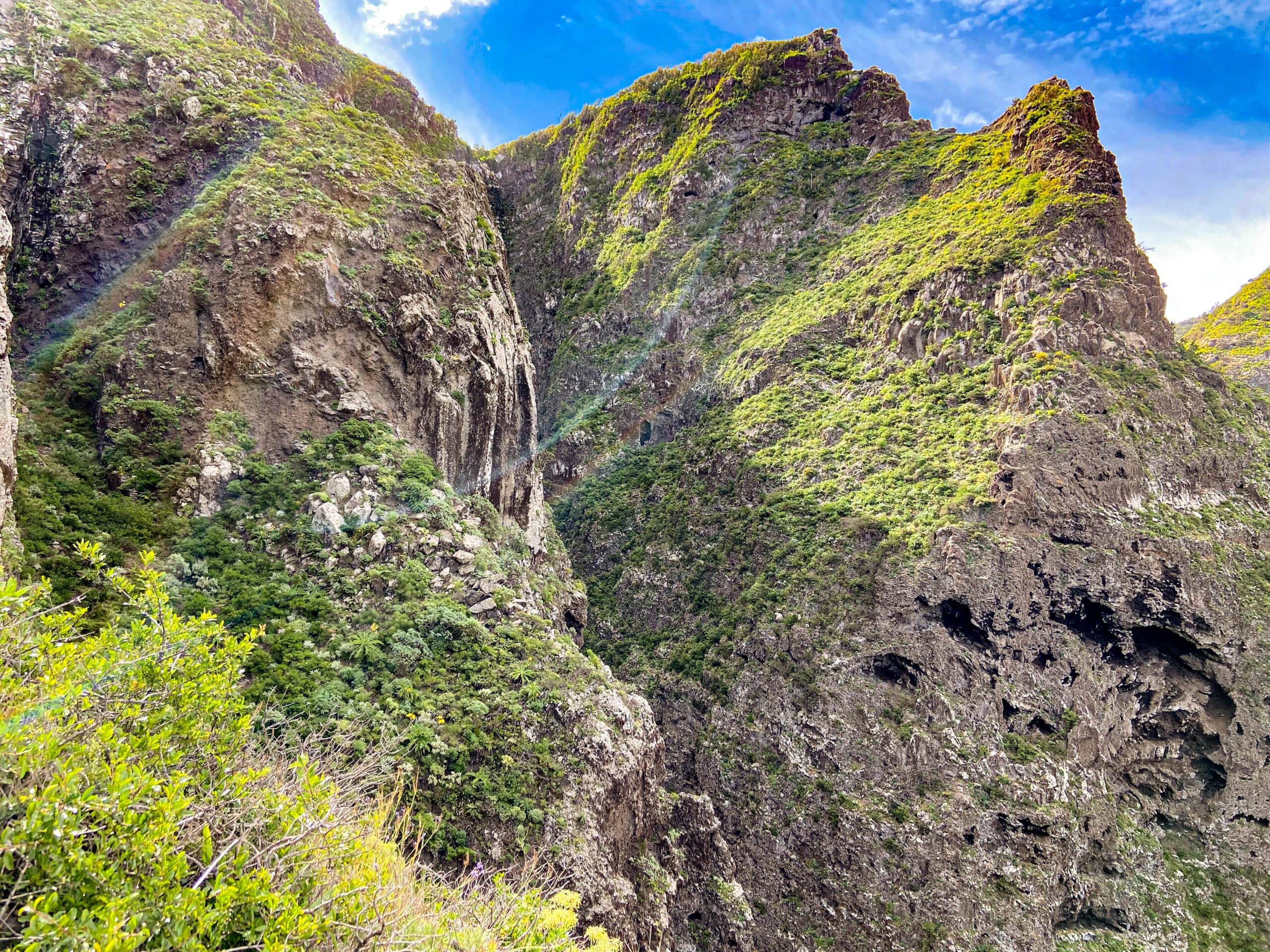 the path leads up the steep cliffs of the north coast