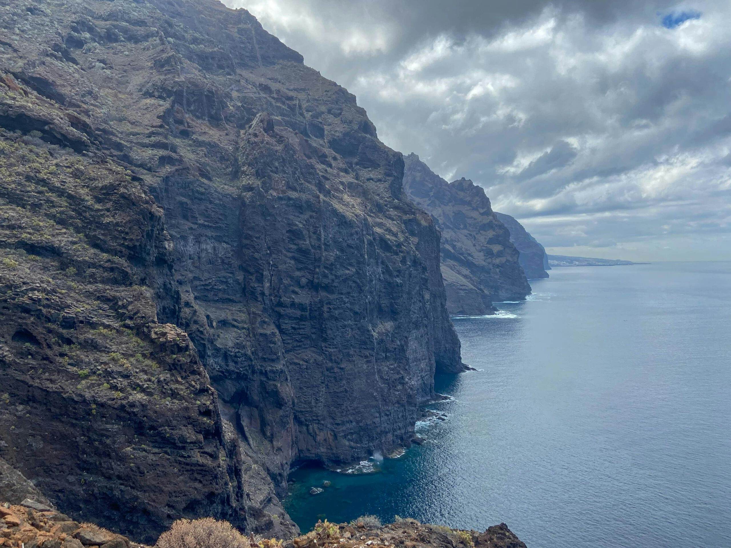 View of the cliffs and Los Gigantes in the background from the path on the cliff edge