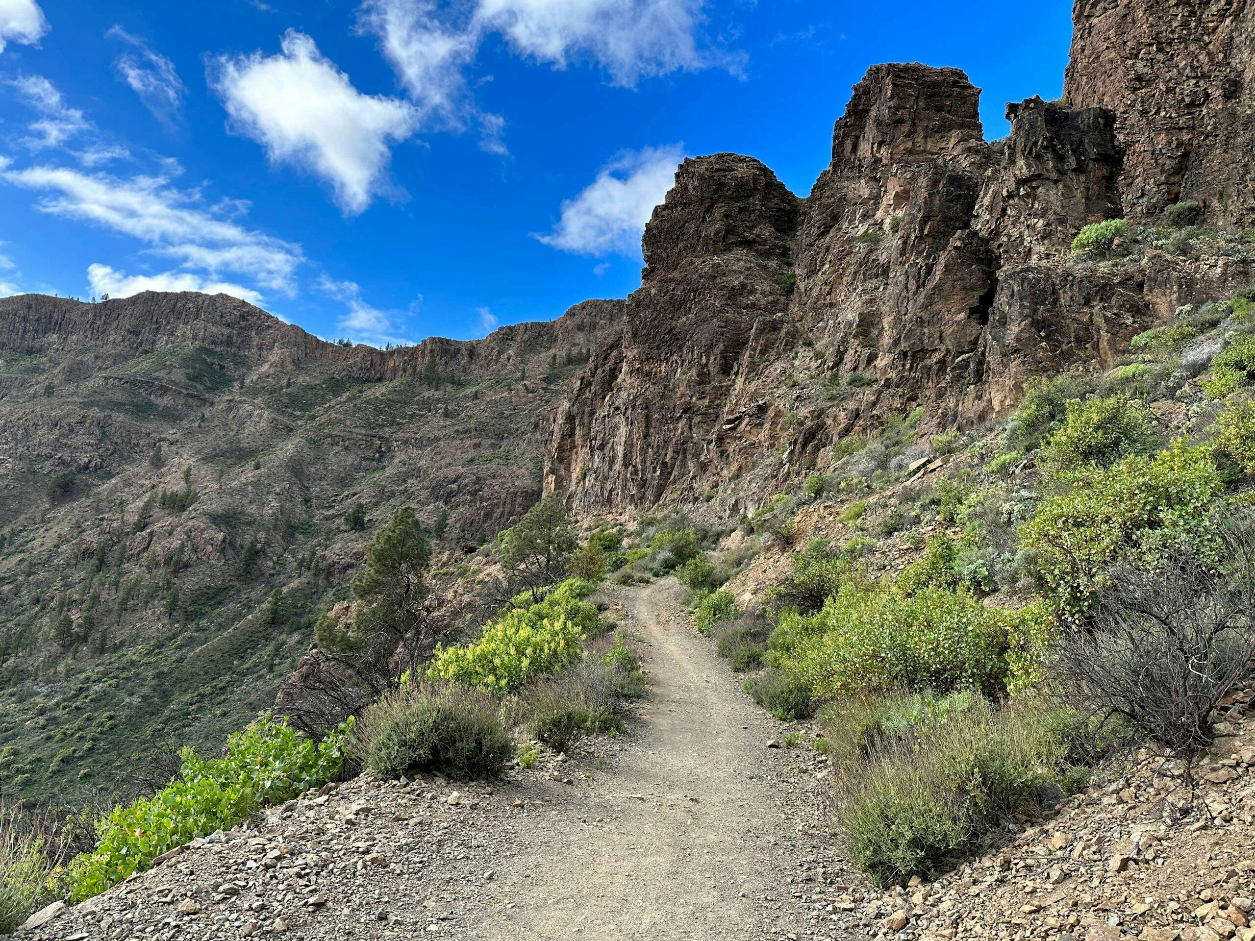 Hiking trail up along the rock massif