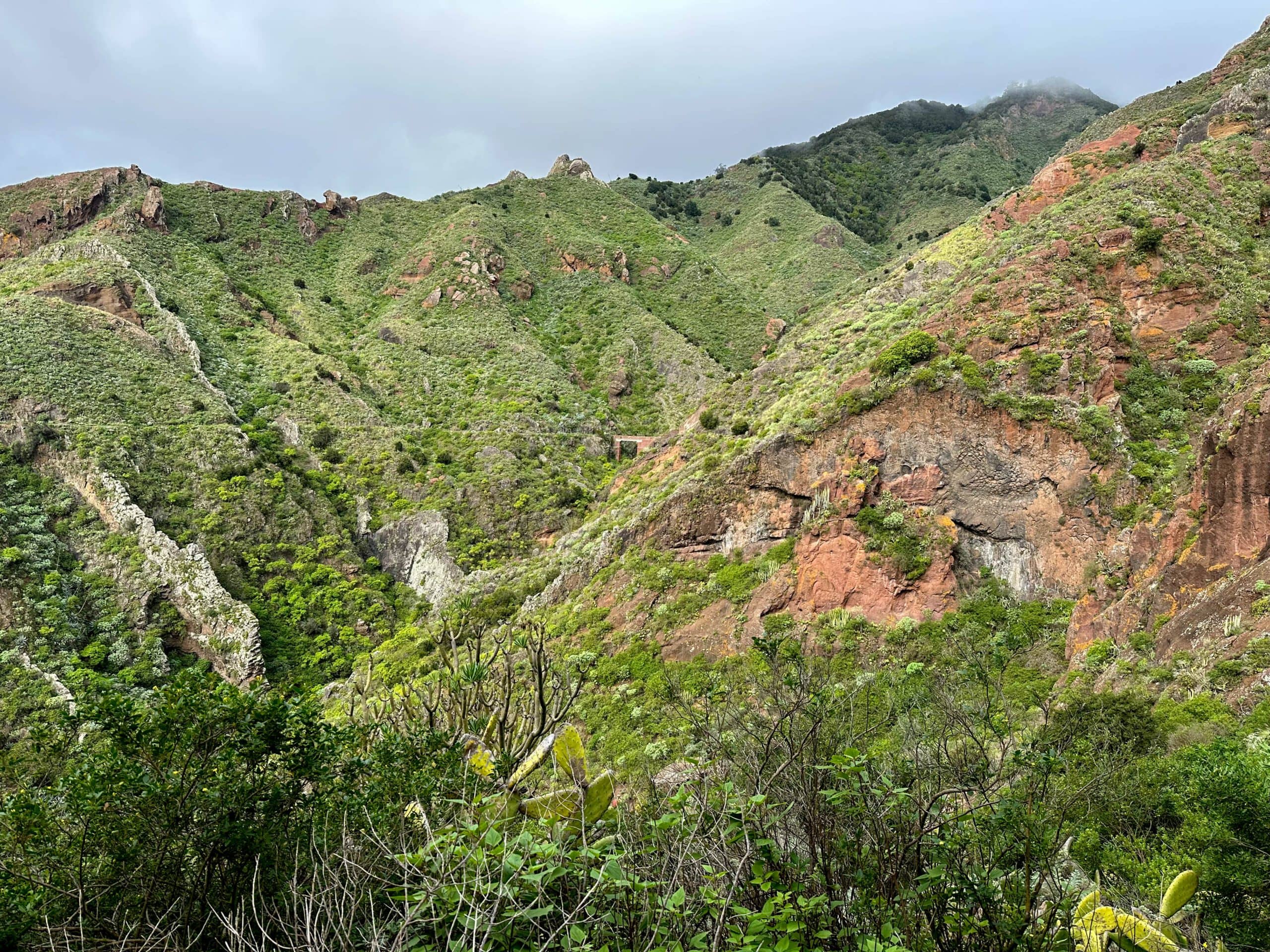 View of the canal path in front of you, which runs around the individual ravines along the slopes of the Anaga Mountains - background a bridge to be crossed.