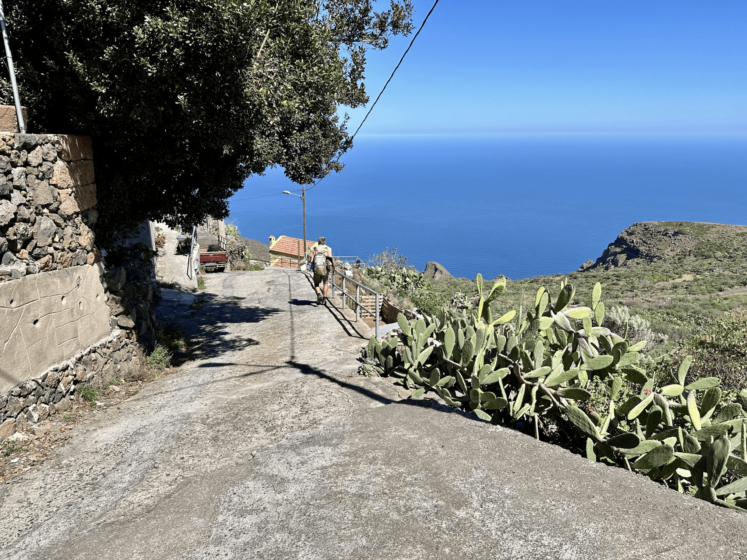 Hiker on the hiking trail in the hamlet of La Cuesta
